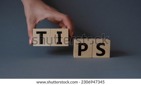Stop symbol. Concept word Stop on wooden cubes. Businessman hand. Beautiful grey background. Business and Stop concept. Copy space.