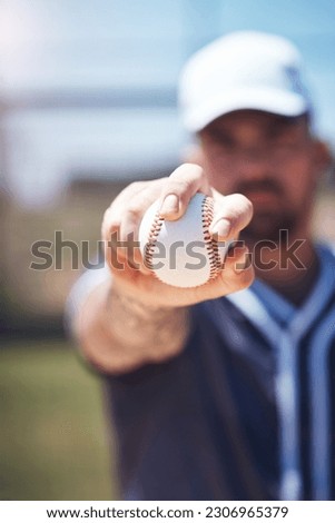Hand holding baseball, closeup and man for sports, field and training with blurred background in sunshine. Softball player, sport and zoom of ball for training, fitness and workout for competition