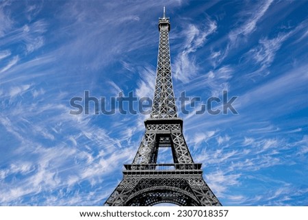 Eiffel Tower against the background of a beautiful sky with clouds. Paris, France 