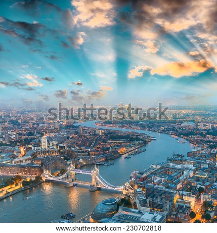 London at night. Aerial view of Tower Bridge area and city lights.