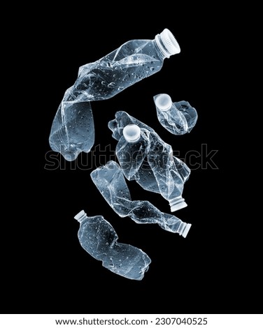 Group of illuminated plastic bottles in the dark Royalty-Free Stock Photo #2307040525