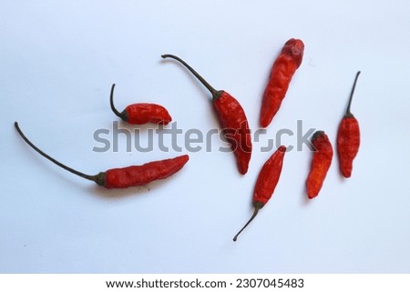 Isolated on a clean white backdrop, a fully ripened chili pepper commands attention, accompanied by a Clipping Path for effortless editing