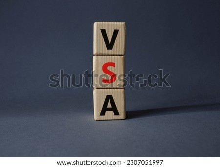 VSA - Volume Spread Analysis symbol. Wooden cubes with word VSA. Beautiful grey background. Business and Volume Spread Analysis concept. Copy space.