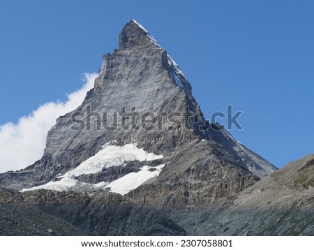 Scenic Matterhorn, Cervino mountain, 4 478 m in european Alps at canton Valais in Switzerland, clear blue sky in 2018 warm sunny summer day on August. Royalty-Free Stock Photo #2307058801