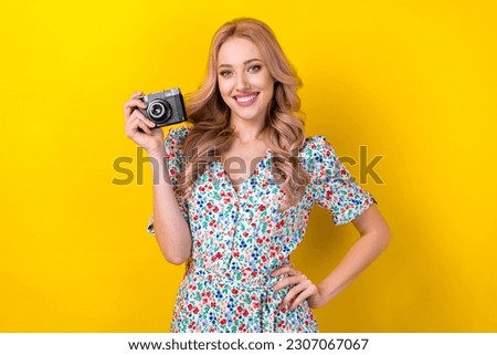 Photo of cheerful charming woman dressed flower print sarafan smiling tacking photo isolated yellow color background