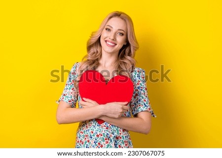 Photo of cheerful adorable lady wear trendy sarafan hand hold big postcard celebrate anniversary isolated on yellow color background