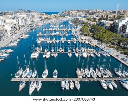 Aero Photography. View from flying drone.Panoramic cityscape of old town and boats near dock in Msida marina, Malta. near the city of Valletta.Top view  Royalty-Free Stock Photo #2307080743