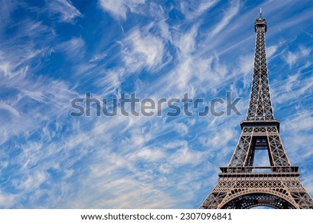 Eiffel Tower against the background of a beautiful sky with clouds. Paris, France 