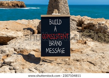 Consistent brand message symbol. Concept words build a consistent brand message on beautiful black chalkboard. Beautiful stone sea background. Business consistent brand message concept. Copy space.