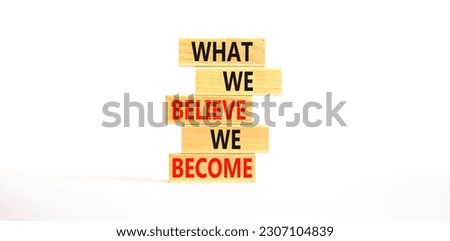 We become or believe symbol. Concept word What we believe We become on wooden block. Beautiful white table white background. Business we become or believe concept. Copy space.