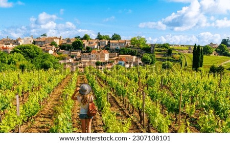 Woman tourist in green vineyard, Bordeaux region, Saint Emilion- France Royalty-Free Stock Photo #2307108101