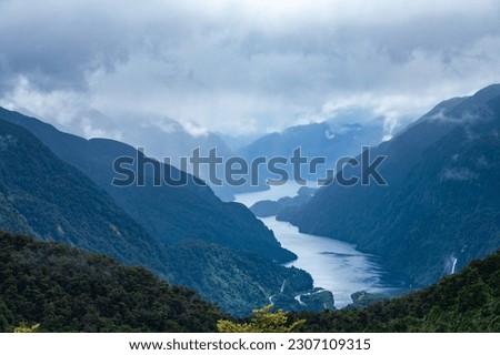 Gloomy rainy sky over the Doubtful Sound, the second longest fiord in Fiordland National Park in South Island of New Zealand Royalty-Free Stock Photo #2307109315