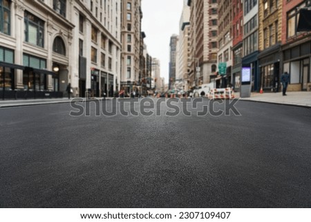  empty asphalt road of a modern New York city with skyscrapers 