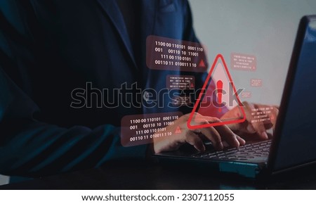 System hacked alert on computer screen after cyber attack on network. Cybersecurity vulnerability on internet, virus, data breach, malicious connection. business people at work. Royalty-Free Stock Photo #2307112055