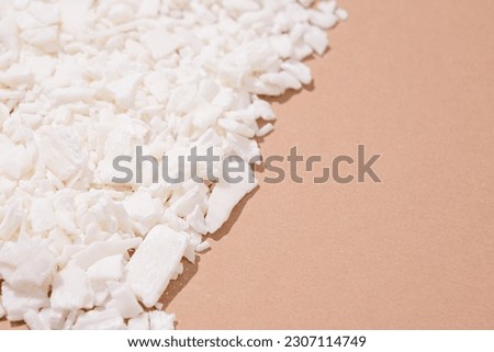Full frame of soy wax flakes for candle making on brown bakground Royalty-Free Stock Photo #2307114749