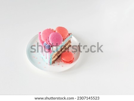 piece of cake with pink and blue decor on white plate