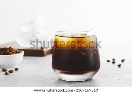 Iced Coffee, Cold Brew Coffee with Ice on Bright Light Grey Background, Refreshing Beverage