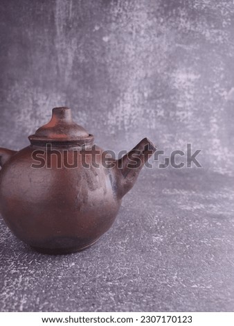 Teapot from earthenware (pottery). A traditional teapot from Indonesia and Asia. It's very unique and artistic. 