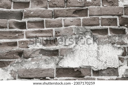 The surface is made of old deformed and brick with stripped plaster. The wall is made of old ancient red brick. Royalty-Free Stock Photo #2307170259