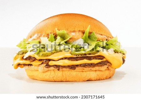 double smash brioche with cheddar and fresh salad on white background Royalty-Free Stock Photo #2307171645