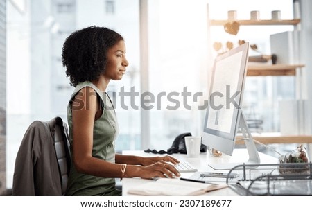 Computer, typing and business woman in office for online research, copywriting and editing for job website. Young african person, editor or journalist on desktop pc or monitor for article or report