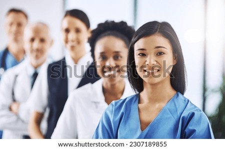 Team, happy woman leader and portrait of doctors and nurses in hospital, teamwork and healthcare. Health, diversity and medicine, confident doctor and group of medical employees in row with smile.