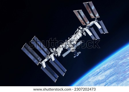 International Space Station in Earth's orbit. Elements of this image furnishing NASA. High quality photo Royalty-Free Stock Photo #2307202473