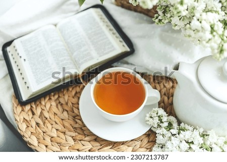 Open bible in spring interior, good morning concept.