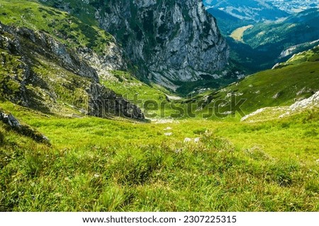 Precipice in the mountains. Dangerous places in the mountains. View on Valley Small Meadow (Malej Laki) in Tatras. Royalty-Free Stock Photo #2307225315