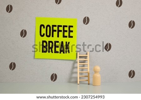 Coffee break inscription on wooden table background