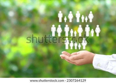 Child's hand and various family member pictograms Royalty-Free Stock Photo #2307264129