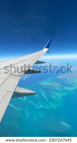 Flying Over Bahamas, Carribean Sea Royalty-Free Stock Photo #2307267645
