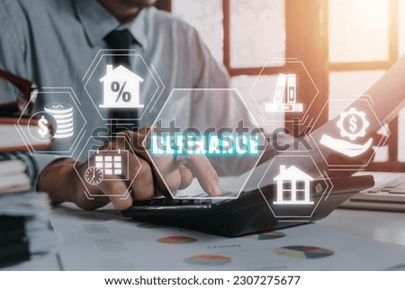 Refinance concept, Businessman using calculator on office desk with refinance icon on virtual screen. Royalty-Free Stock Photo #2307275677