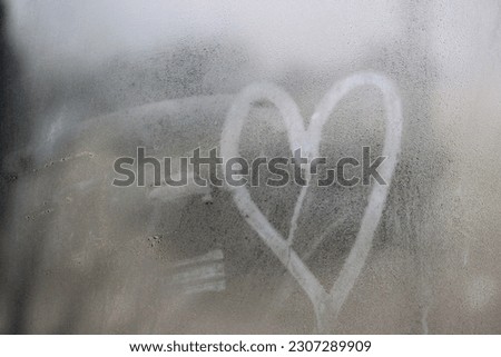 picture of love in the window glass in my home