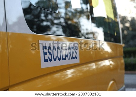 bus for transporting students. where it reads ESCOLARES translates into english scholars