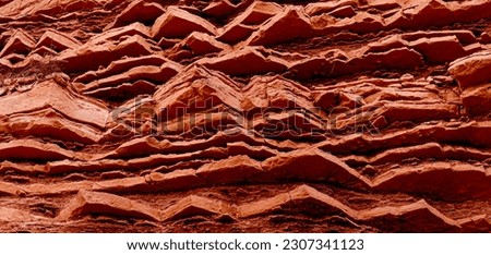 geological rocky layers, bright natural stone texture background Royalty-Free Stock Photo #2307341123