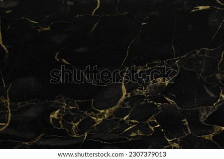 Beautiful black and gold marble surface as background