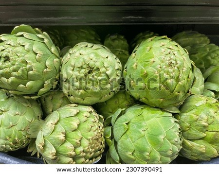 Artichokes on display at the supermarket.