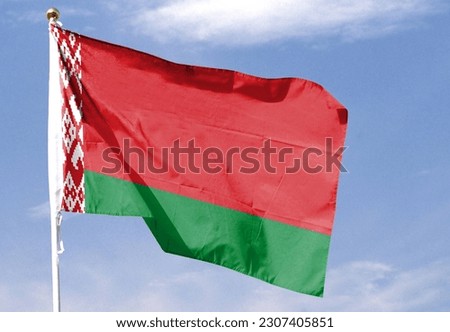 Belarus flag in the cloudy sky. waving in the sky Royalty-Free Stock Photo #2307405851
