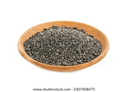 black sesame powder isolated in wood plate on white background. pile of black sesame powder isolated. heap of black sesame powder isolated                                      Royalty-Free Stock Photo #2307408475