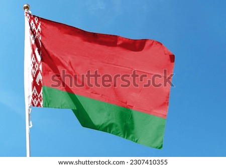 Belarus flag in the cloudy sky. waving in the sky Royalty-Free Stock Photo #2307410355