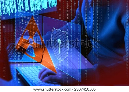 Nuclear deterrence. Hacker using computers in darkness, binary code and virtual screen with shield and warning radiation symbols Royalty-Free Stock Photo #2307410505