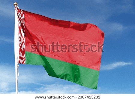 Belarus flag in the cloudy sky. waving in the sky Royalty-Free Stock Photo #2307413281