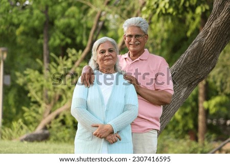 Indian Senior happy couple enjoying in park