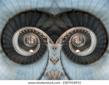 Abstract view of a double spiral staircase. Image reminiscent of owl eyes.