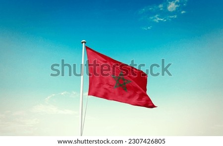 Waving flag of Morocco in beautiful sky. Morocco flag for independence day.