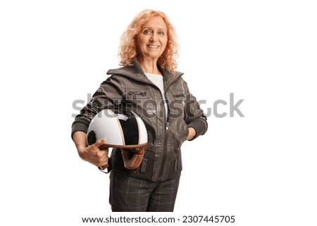 Mature woman in a leather jacket holding a helmet isolated on white background