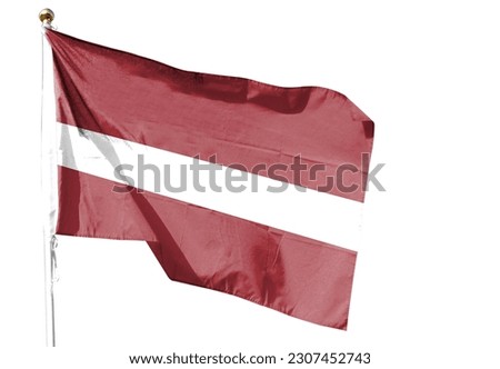 Latvian flag in the cloudy sky. waving in the sky