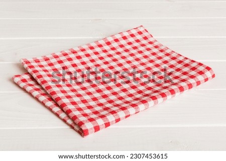 top view with red empty kitchen napkin isolated on table background. Folded cloth for mockup with copy space, Flat lay. Minimal style. Royalty-Free Stock Photo #2307453615