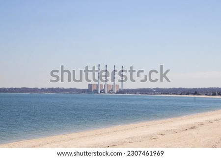 Picture of a power plant by the beach 